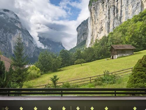 a view of a mountain from a train window at Chalet Chalet am Schärm by Interhome in Lauterbrunnen