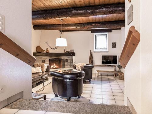 a living room with a fireplace and a couch at Holiday Home La Formighera by Interhome in Gerra Verzasca