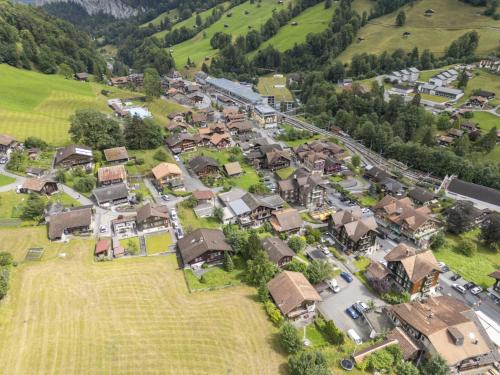 an aerial view of a small village with houses at Chalet Chalet am Schärm by Interhome in Lauterbrunnen