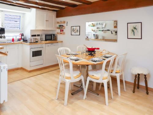 a kitchen and dining room with a table and chairs at Apartment Les Moulins by Interhome in Verbier