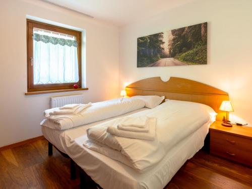 Postel nebo postele na pokoji v ubytování Apartment Ca' di nonón by Interhome