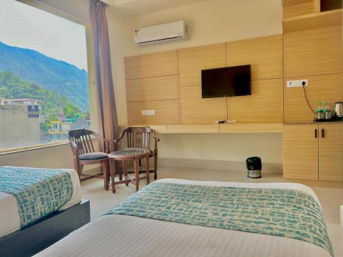 Televisyen dan/atau pusat hiburan di Hotel Aqua Vibes
