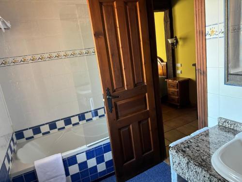 a bathroom with a tub and a toilet and a sink at La Venta de Quijas in Quijas