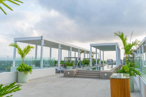 a view of a building with palm trees on it at Hotel Mio Riviera Nayarit - Adults Only in Nuevo Vallarta 