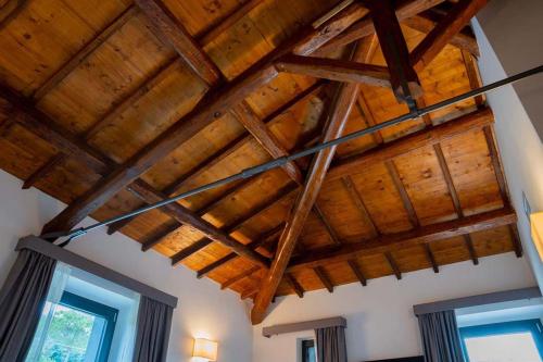 a room with wooden ceilings and wooden beams at Le Cappuccinelle Suites&SPA in Perugia