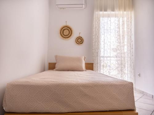 Postel nebo postele na pokoji v ubytování Athina's Home