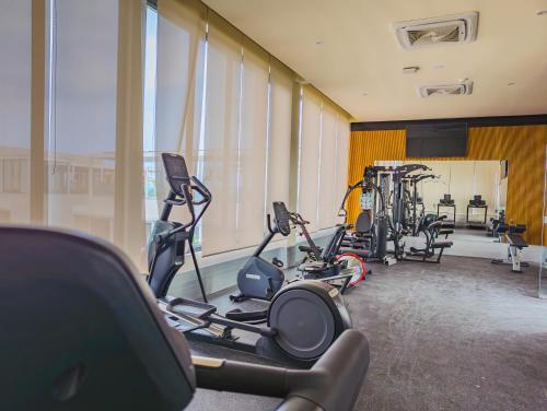 a gym with treadmills and ellipticals in a building at Hotel Mio Riviera Nayarit - Adults Only in Nuevo Vallarta 