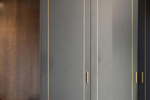 a white cabinet with two handles on it at Le Cappuccinelle Suites&SPA in Perugia