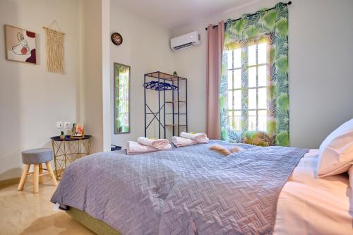 Ένα ή περισσότερα κρεβάτια σε δωμάτιο στο PLACIDUS SUMMERhouse ARILLAS