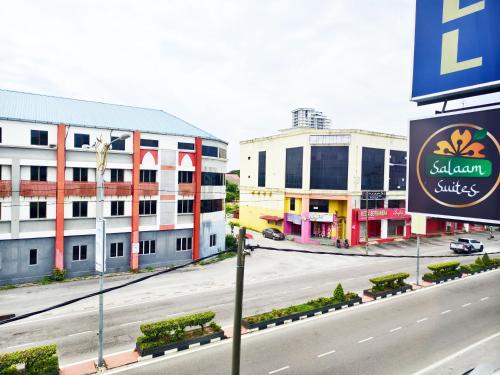 a view of a street with buildings and a sign at Salaam Suites Hotel in Kota Bharu