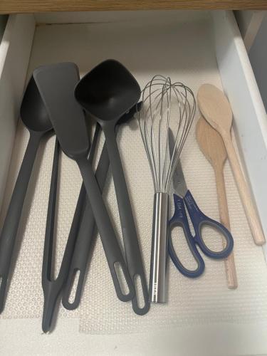 a drawer filled with different types of kitchen utensils at Charmantes Apartment in Karlsruhe