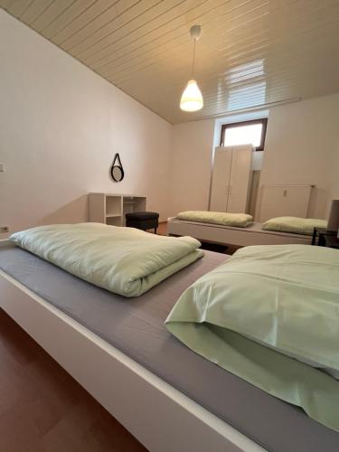 a bedroom with two beds in a room at Charmantes Apartment in Karlsruhe