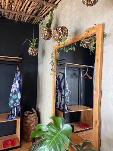 a mirror in a room with potted plants at Eagle View Lodge - Kigali in Kigali