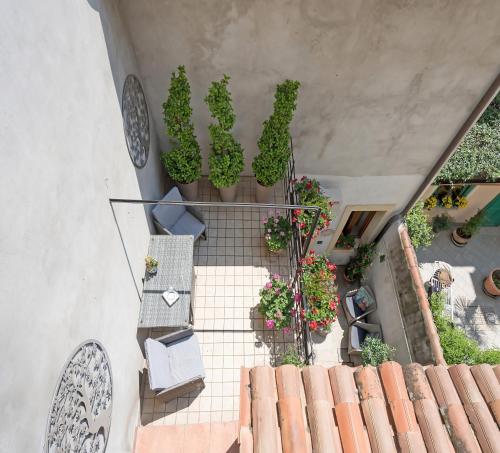 an overhead view of a staircase with potted plants at Veronetta House in Verona