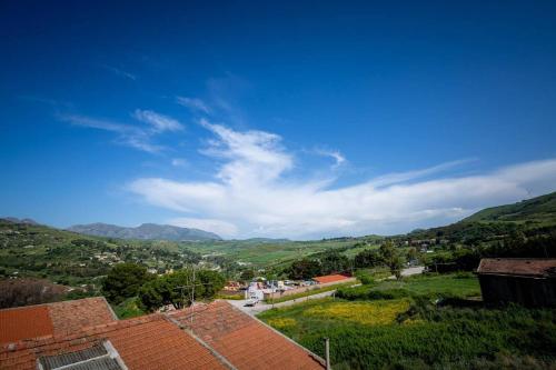 a view of a town with mountains in the background at Bianca Casa in Bolognetta