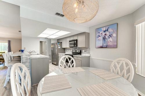 a kitchen and dining room with a table and chairs at Spring Hill Home Private Pool, 9 Mi to Beach! in Spring Hill