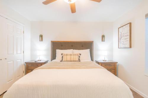a bedroom with a large bed with two night stands at Lower Northern Tanada Suite 2.0 (B) in North Pole