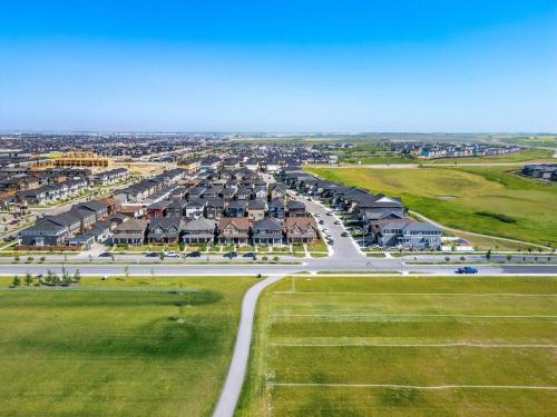 an aerial view of a road with houses at Large House Near Calgary Airport with Central AC, Double Car Garage Parking, Upgrade Stay, Netflix, Sleeps 8 in Calgary