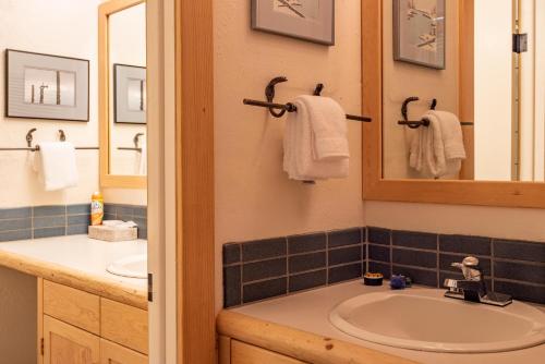 a bathroom with a sink and a mirror at Edelweiss Condo 223B in Ketchum