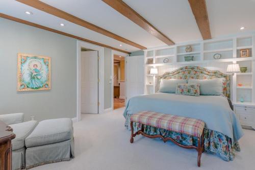 a bedroom with a bed and a chair and a couch at Lodge Apartment II Condo 878 in Sun Valley