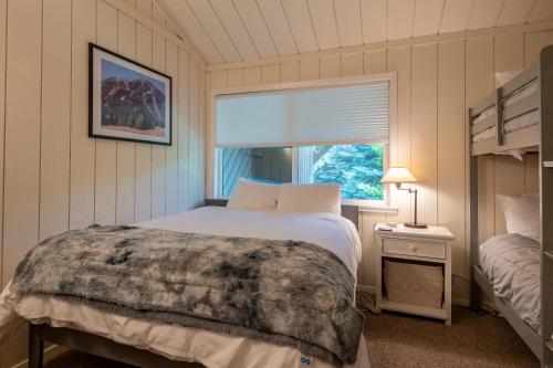 a bedroom with a bed and a window at Villager Condo 1207 in Sun Valley