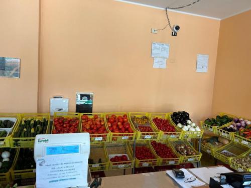 a store filled with baskets of fruits and vegetables at Agriturismo Il Melograno in Tessera