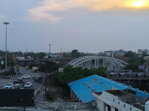 a view of a city with a blue roof at HOTEL JOGI GUEST HOUSE welcome all families, friends, groups, couples, singles fully Airconditioner, attach washrooms, lift, wifi, 24 hours room service, power backup in Amritsar