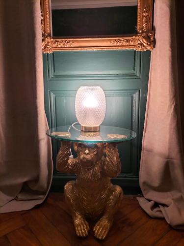 a table with a bear with a light on it at Nancy Vieille Ville Stanislas in Nancy