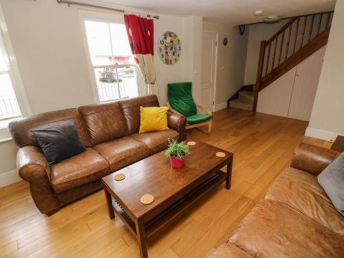 a living room with a couch and a coffee table at Archway House in Haverfordwest