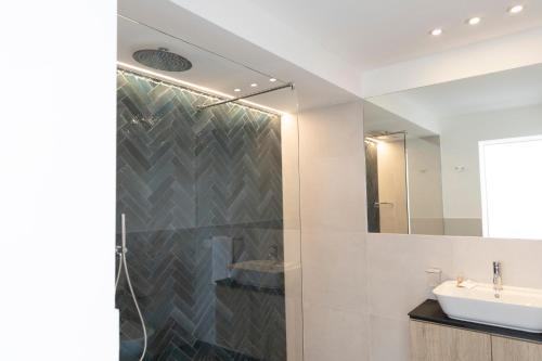 a bathroom with a sink and a mirror at La Dimora dei Paladini in Bagheria