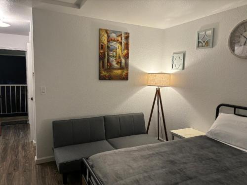 a bedroom with a bed and a painting on the wall at Brownsville Motel in Brownsville