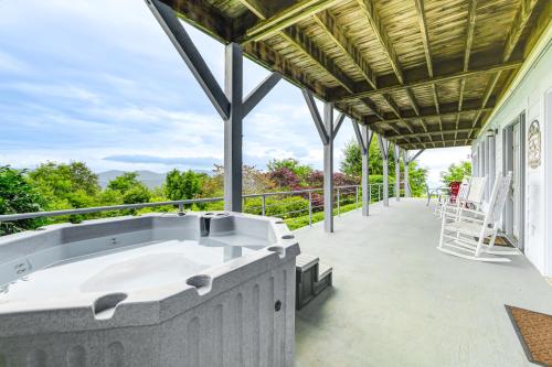 a hot tub on the balcony of a house at Near Hiking Trails Luxe Canton Getaway with Grill in Canton