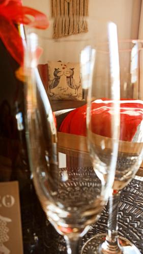 two empty wine glasses sitting on a table at NemCsuri Vendegház Somló in Somlóvásárhely