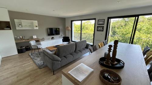 Posezení v ubytování Superbe appartement avec vue sur la foret du Touquet Résidence les Dunes