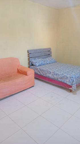 Ένα ή περισσότερα κρεβάτια σε δωμάτιο στο casa em buzios