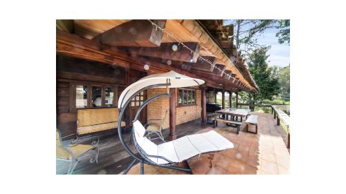 a building with a slide in front of it at Acogedora cabaña con jacuzzi rodeada de naturaleza in Valle de Bravo