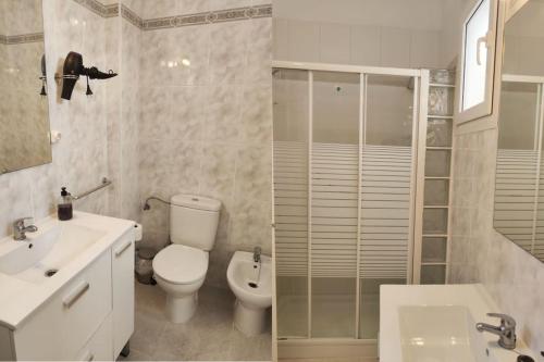 a bathroom with a toilet and a sink and a shower at Breathe Bajamar - Surf, Piscinas Naturales, Senderismo in Bajamar