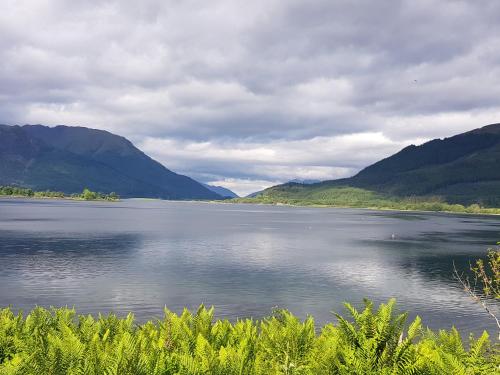 a large body of water with mountains in the background at Callart View in Ballachulish