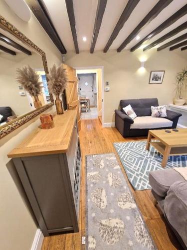 a living room with a couch and a table at Stylish Little Bowden Retreat - Market Harborough in Market Harborough