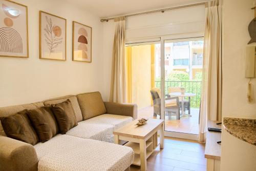 a living room with a couch and a table at Apartment Albir Playa Florida in Albir