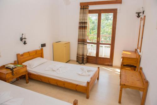 Katil atau katil-katil dalam bilik di Hotel Velissarios