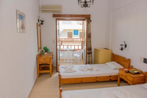 Katil atau katil-katil dalam bilik di Hotel Velissarios