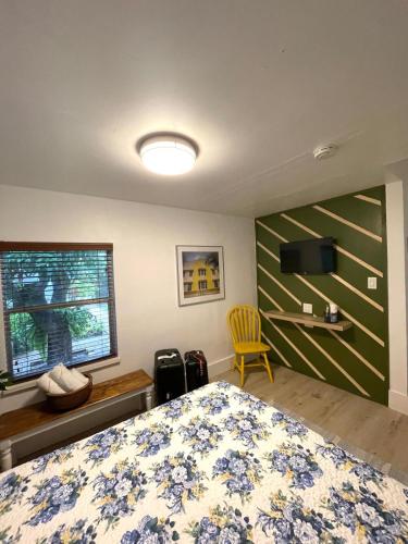 a bedroom with a bed and a television in it at Cozy Room in the Heart of Little Havana in Miami