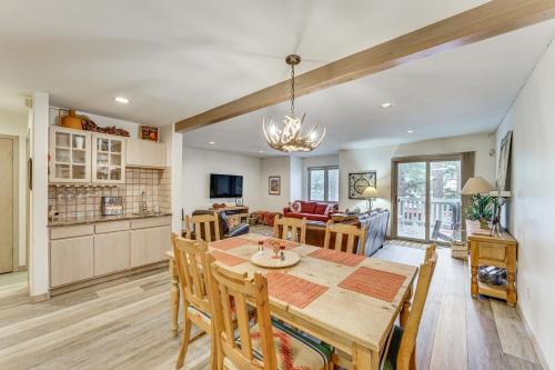 a dining room and kitchen with a table and chairs at Half Mi to Angel Fire Resort Townhome with Grill! in Angel Fire
