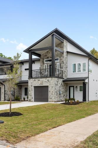 a large house with a porch and a garage at Arlington Retreat in Arlington