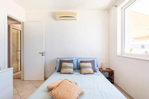 Ένα ή περισσότερα κρεβάτια σε δωμάτιο στο Summertime Villa