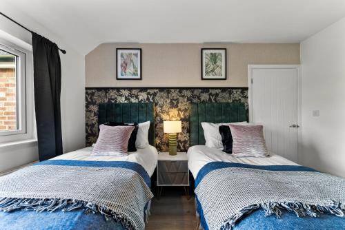 Ένα ή περισσότερα κρεβάτια σε δωμάτιο στο Spacious 4 Bed In Cambridge - Garden - Games Room