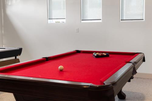 a pool table with a ball on top of it at NEW 3bd, 2.5 bath w Game room lounge, Hot tub, pool, fire pit, and more in Santa Clara