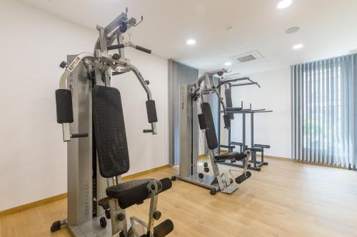 a gym with two tread machines in a room at Blue Star Luxury Hotel in Sofia