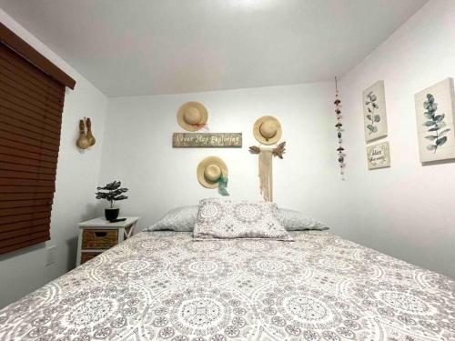a bedroom with a bed and a cross on the wall at Independent Studio in Little Havana in Miami